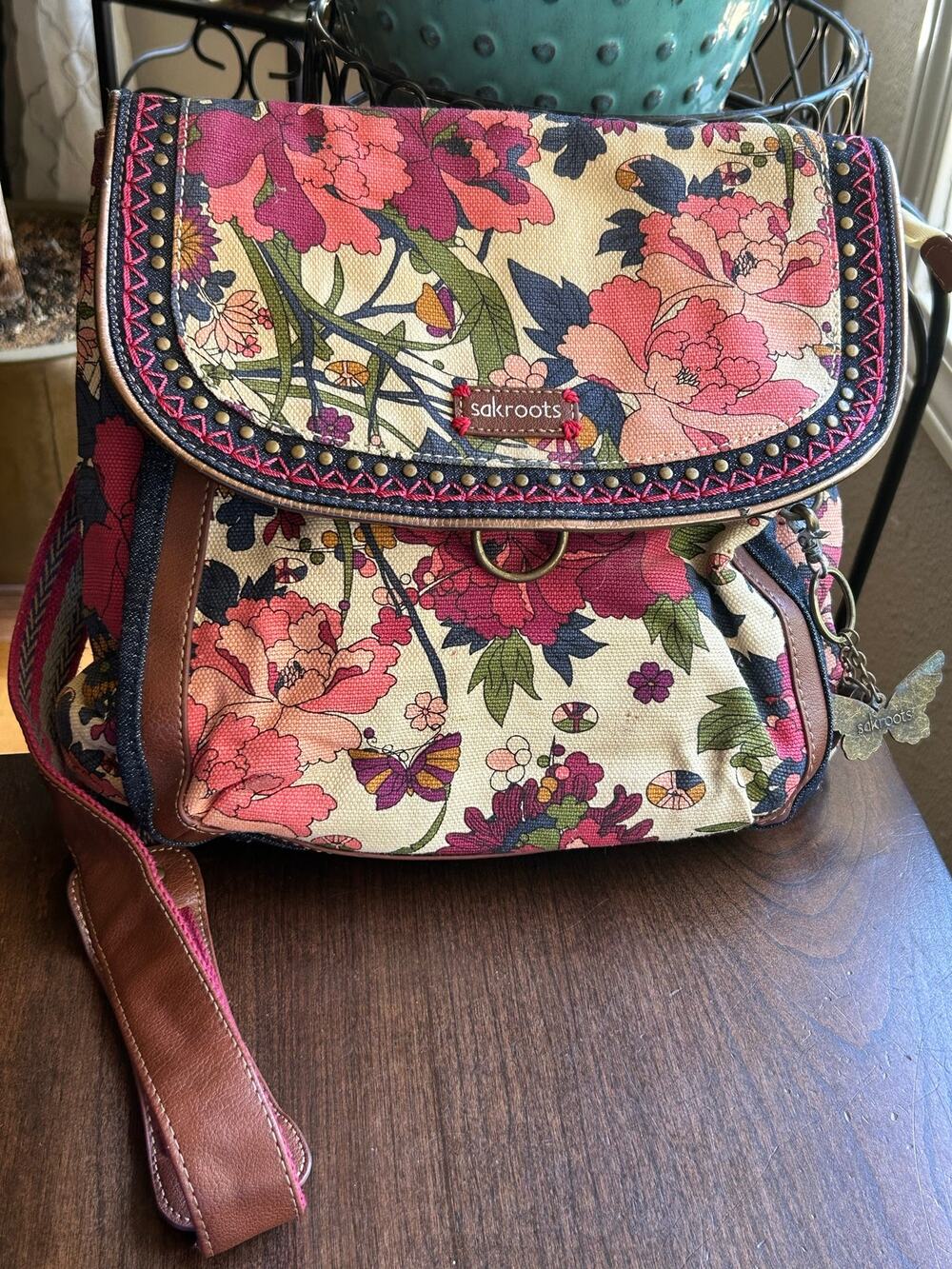 Sakroots convertible backpack featuring a floral print canvas exterior
